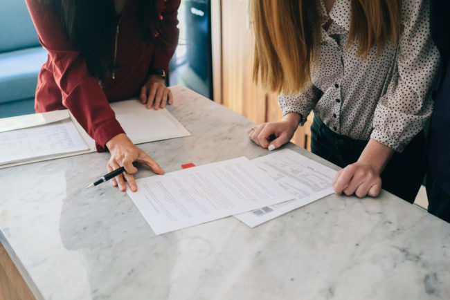 Real Estate: Young couple at a house showing