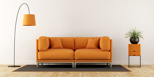 Cushions On Sofa At Home Against Wall