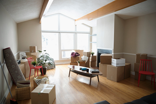 Moving into new home, cardboard boxes and belongings