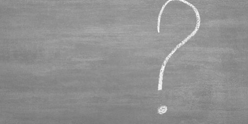 Close-Up Of Question Mark On Blackboard