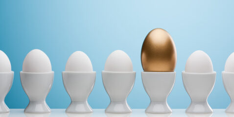 Golden egg in egg cup