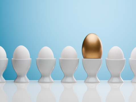 Golden egg in egg cup