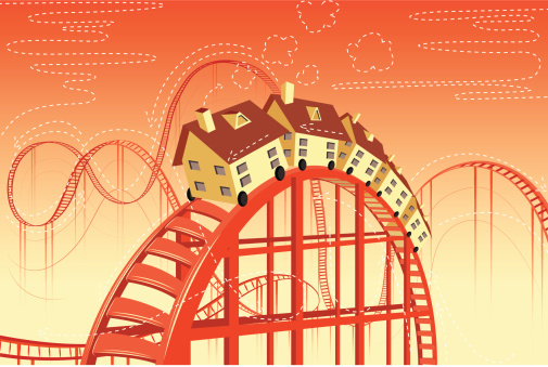 Illustrative image of houses on rollercoaster representing real estate ups and downs