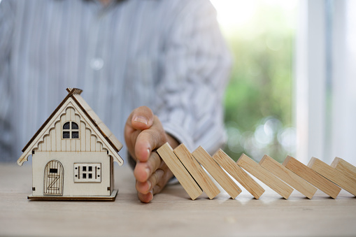 home insurance,Domino,Wooden block,Business risk, strategy and planing concept idea. it's all good especially for buyers